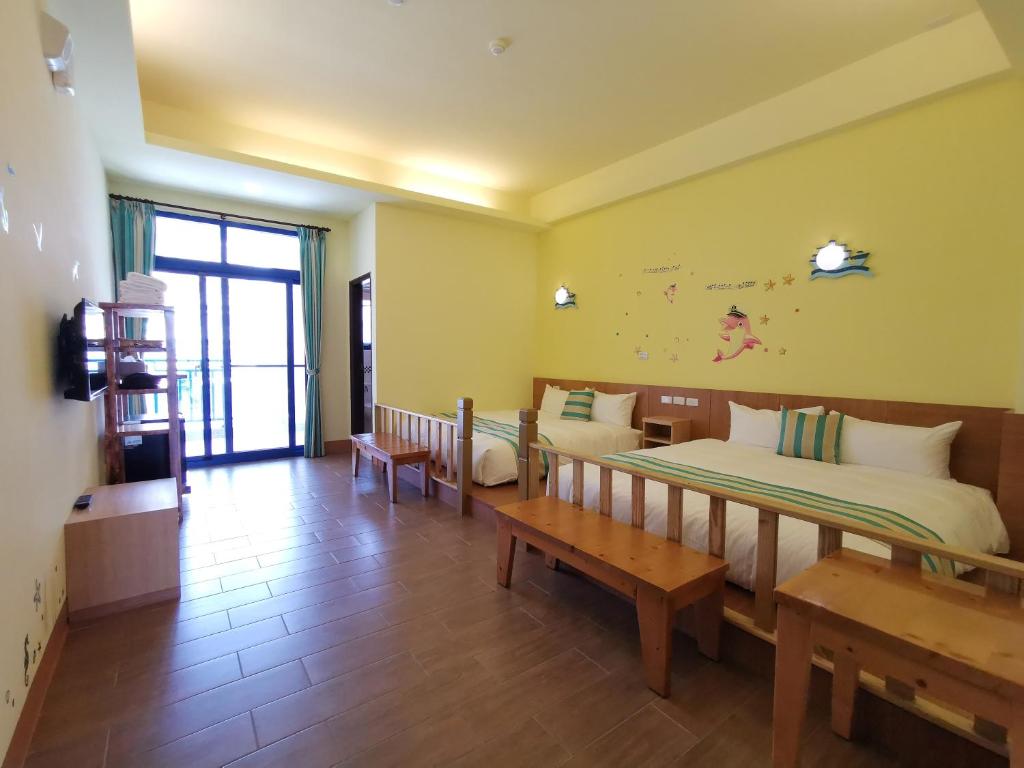 Postel nebo postele na pokoji v ubytování Love Ocean & Happy Bay HomeStay