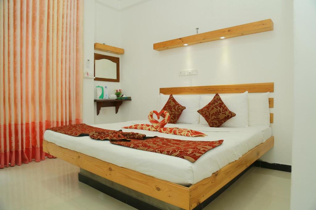 Postel nebo postele na pokoji v ubytování Awon Mirissa