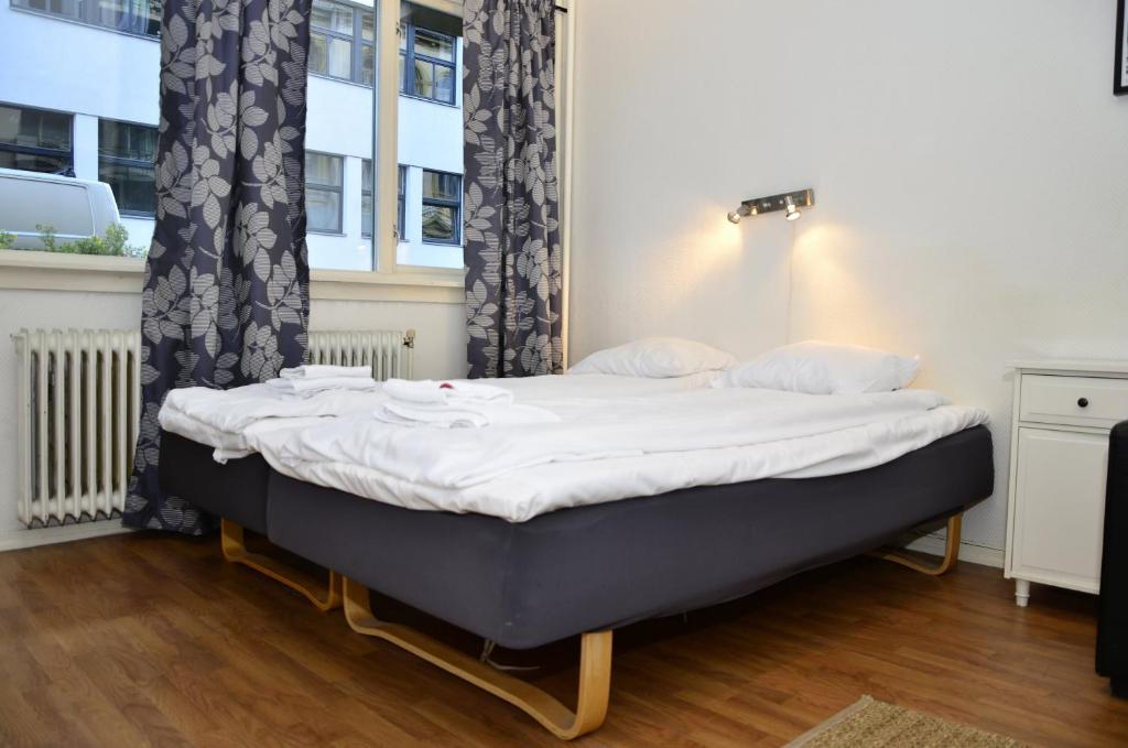 Postel nebo postele na pokoji v ubytování Forenom Serviced Apartments Oslo Rosenborg