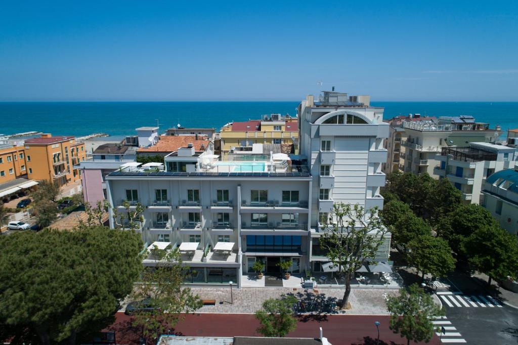 an aerial view of a building with the ocean in the background at Hotel Gala in Misano Adriatico