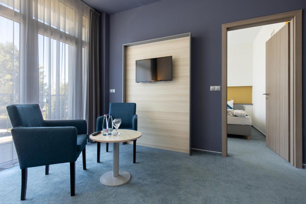 Posteľ alebo postele v izbe v ubytovaní Hotel Yacht Wellness & Business