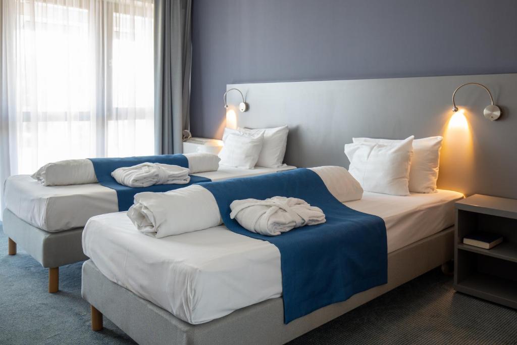 Posteľ alebo postele v izbe v ubytovaní Hotel Yacht Wellness & Business