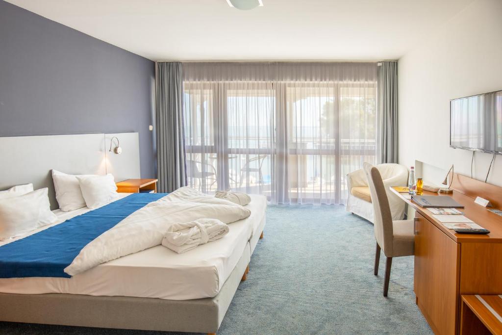 Posteľ alebo postele v izbe v ubytovaní Hotel Yacht Wellness & Business