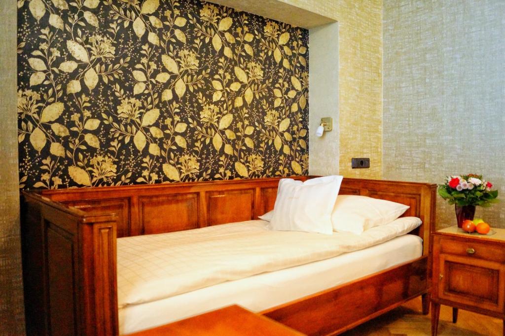 Postel nebo postele na pokoji v ubytování Boutiquehotel Oberkirch im Zentrum