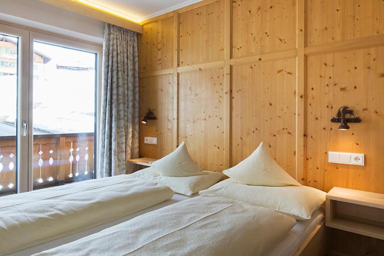 Postel nebo postele na pokoji v ubytování Hotel Anemone