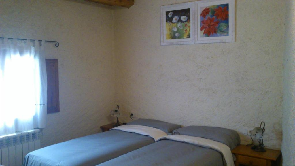 Postel nebo postele na pokoji v ubytování Cal Gabriel