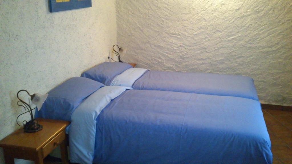 Postel nebo postele na pokoji v ubytování Cal Gabriel