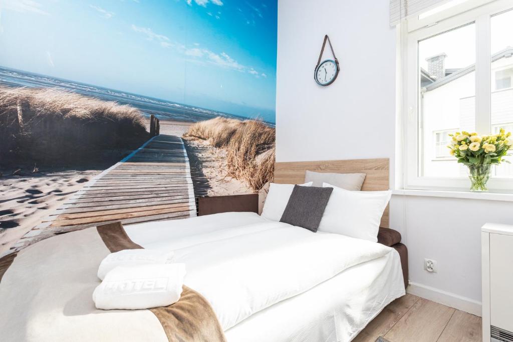 Posteľ alebo postele v izbe v ubytovaní Riviera Residence Apartments