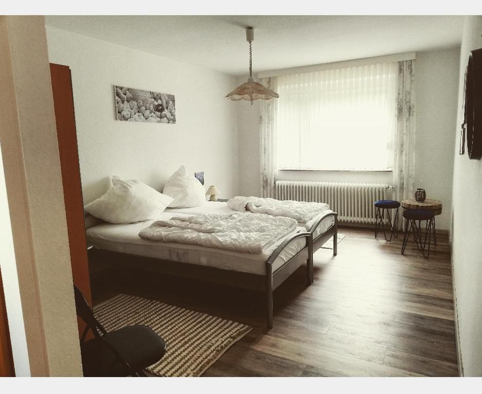 מיטה או מיטות בחדר ב-Nordseebriese