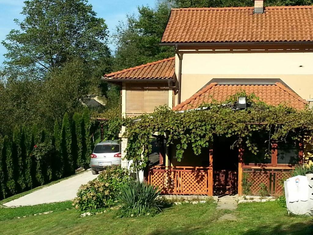 a car parked in front of a house at Holiday Home Pharaoh in Visoko