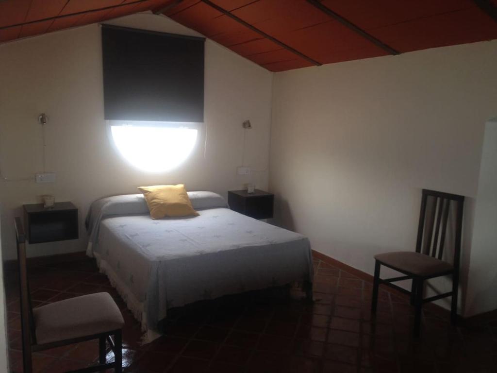 A bed or beds in a room at Ático en Ciudad Jardín
