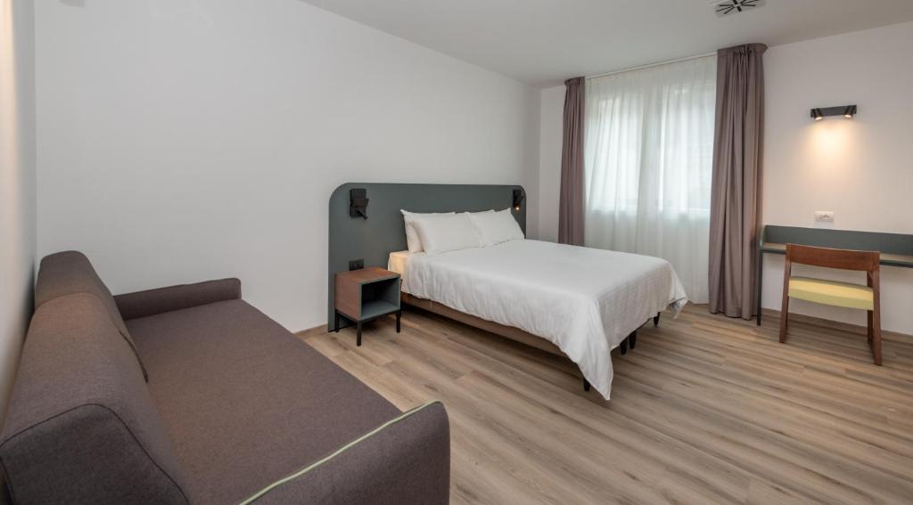 Postel nebo postele na pokoji v ubytování Hotel Canton dell'Orto