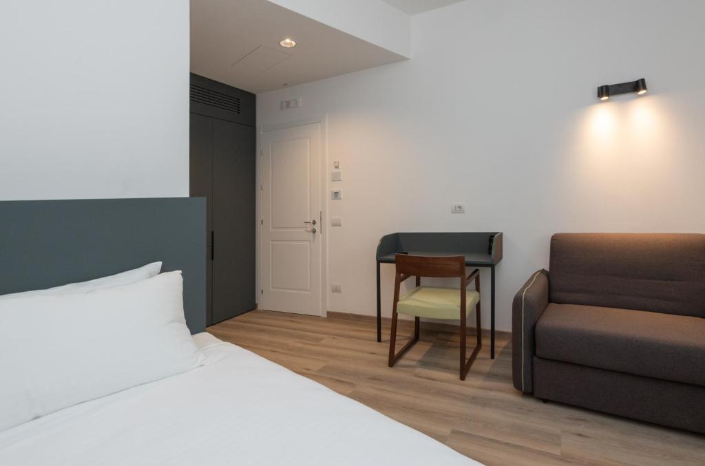 Postel nebo postele na pokoji v ubytování Hotel Canton dell'Orto