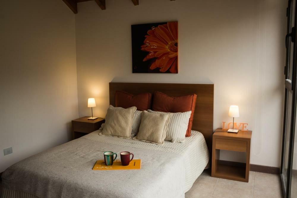 מיטה או מיטות בחדר ב-Departamento San Martin de los Andes Centrico y Moderno