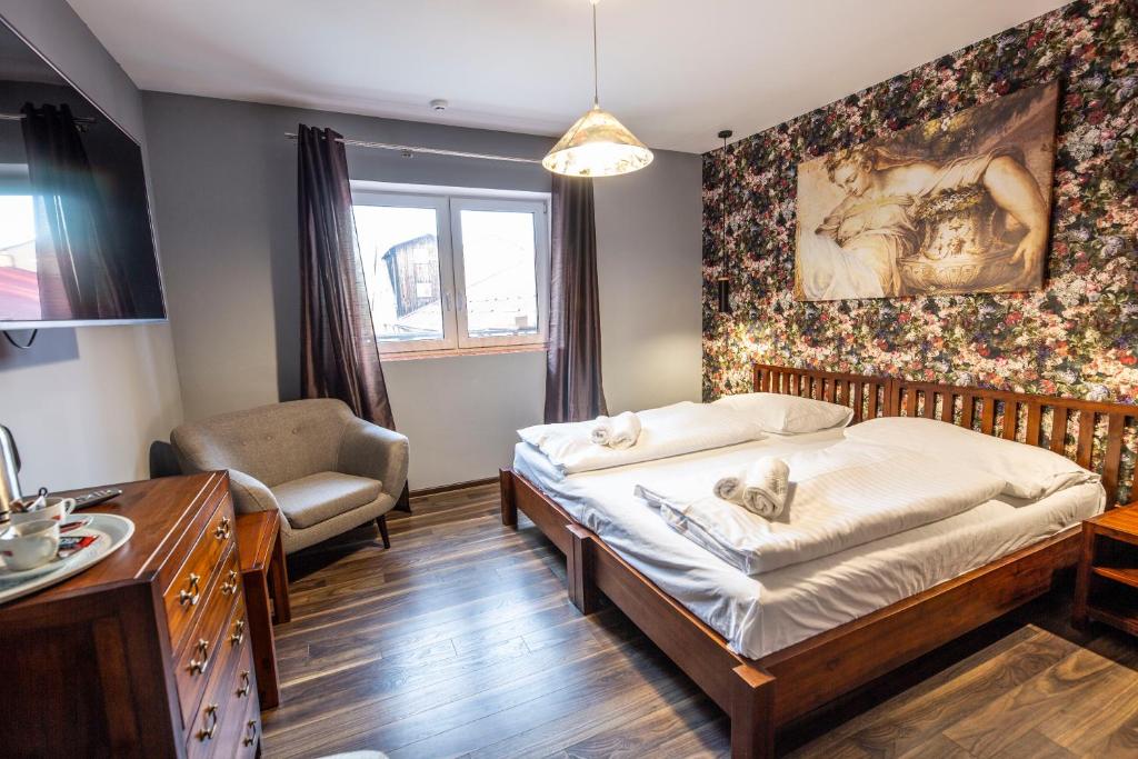Postel nebo postele na pokoji v ubytování In Spirit, hotel v Rožnovském pivovaru - Pivní Lázně, Wellness & Čokoládovna