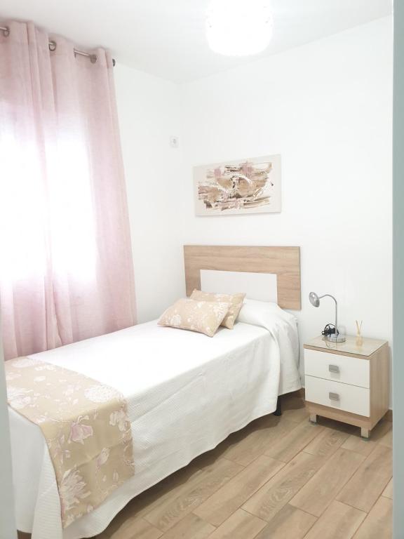 A bed or beds in a room at Doña Lola House
