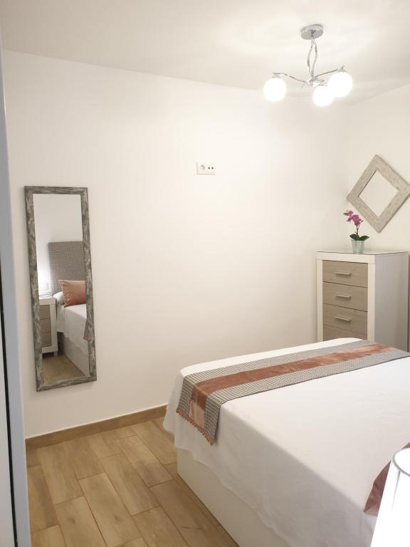 A bed or beds in a room at Doña Lola House
