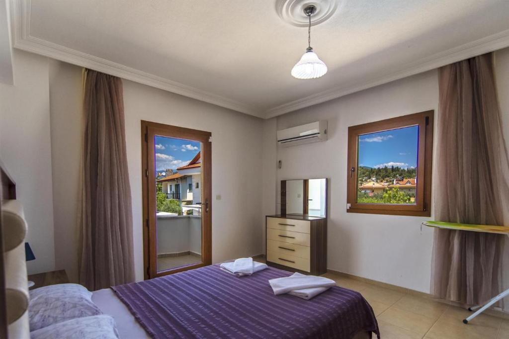 Postel nebo postele na pokoji v ubytování Villa Ekin