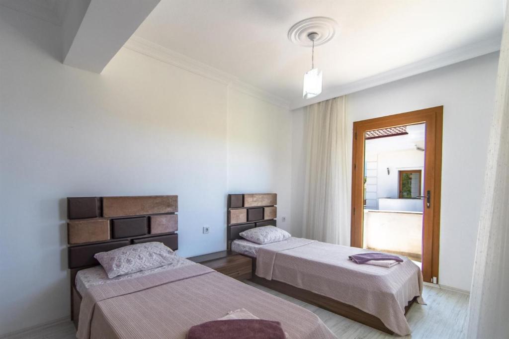 Postel nebo postele na pokoji v ubytování Villa Ekin
