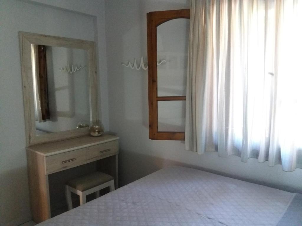 Posteľ alebo postele v izbe v ubytovaní Vourvourou Antonis House