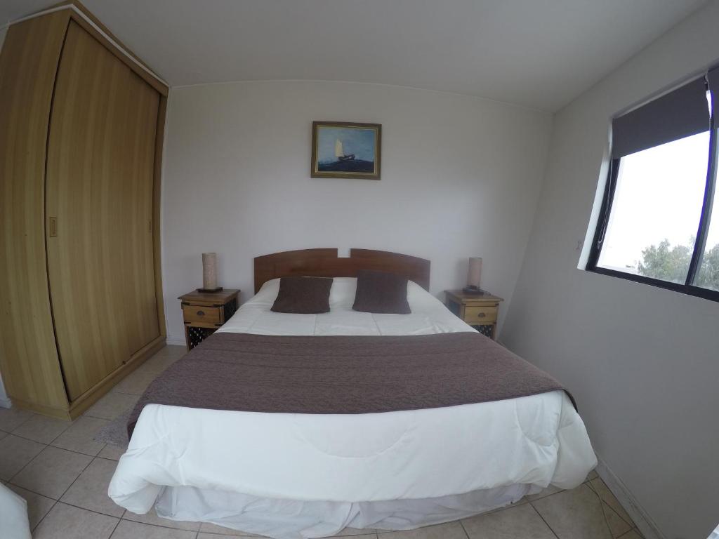Postel nebo postele na pokoji v ubytování Hotel Blanco Encalada