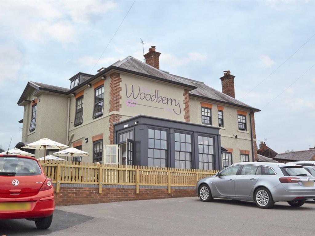 a house with a car parked in front of it at Woodberry Inn in Bridgnorth