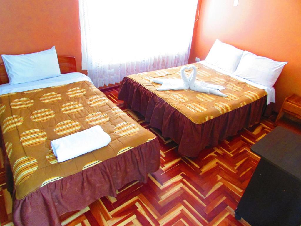 Postel nebo postele na pokoji v ubytování Maya Inn