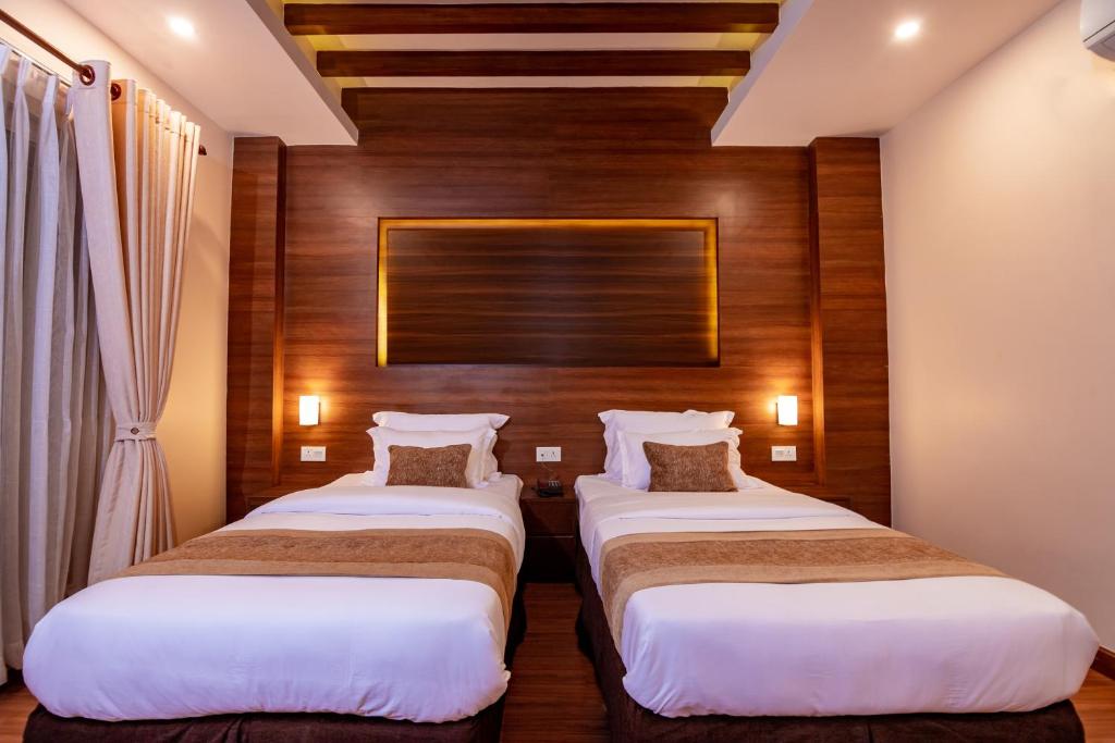 Postel nebo postele na pokoji v ubytování Sunshine Boutique Hotel