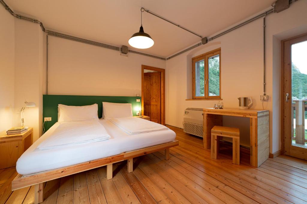 Postel nebo postele na pokoji v ubytování Limarò B&B