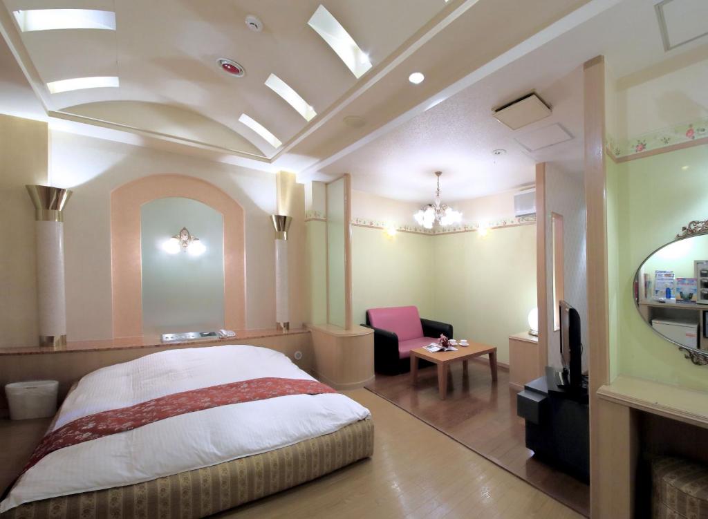 Postel nebo postele na pokoji v ubytování Hotel Mio City (Adult Only)