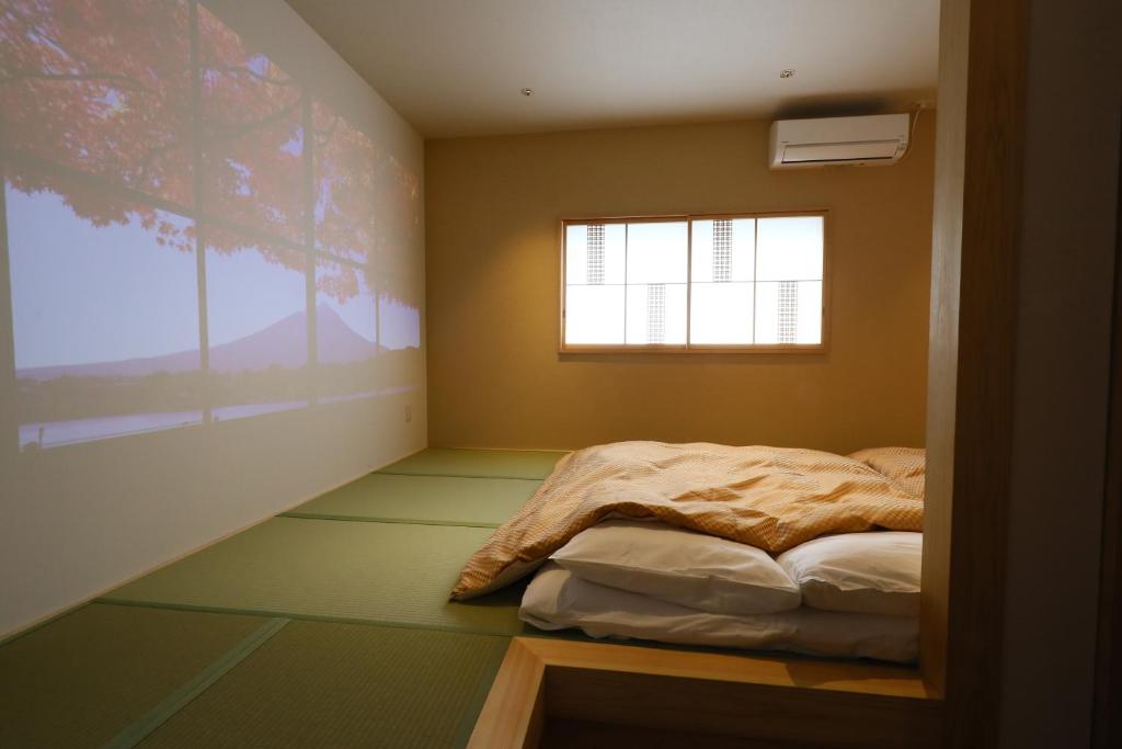 Postel nebo postele na pokoji v ubytování Wa Style Tokyo