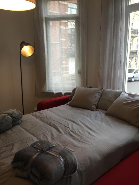 מיטה או מיטות בחדר ב-Chez Natha