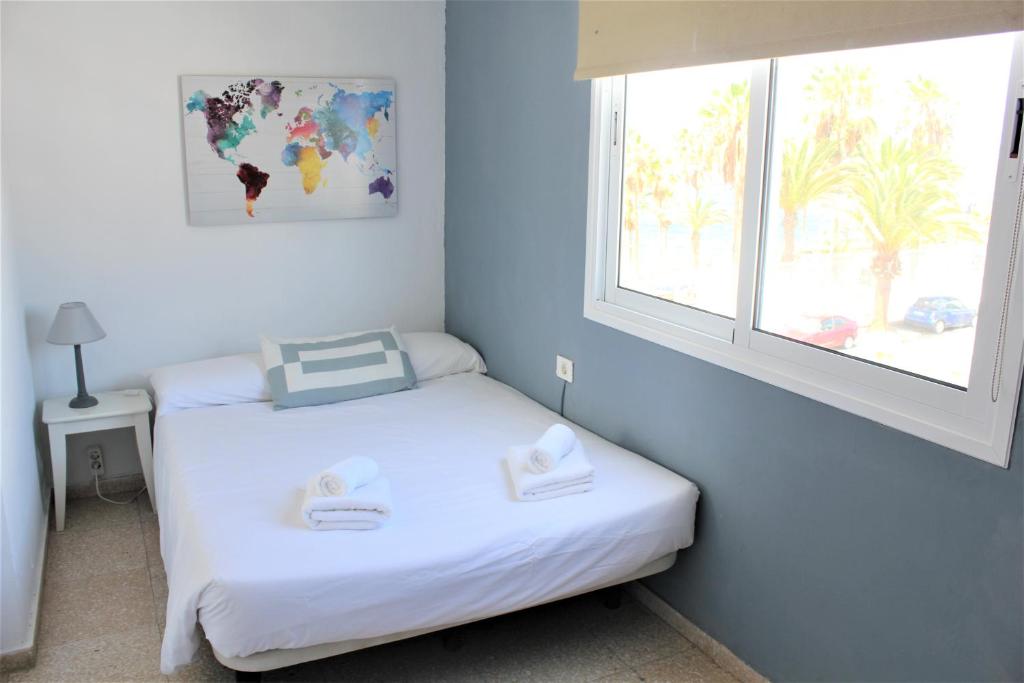 Posteľ alebo postele v izbe v ubytovaní Apartamento con vistas, playa y WIFI