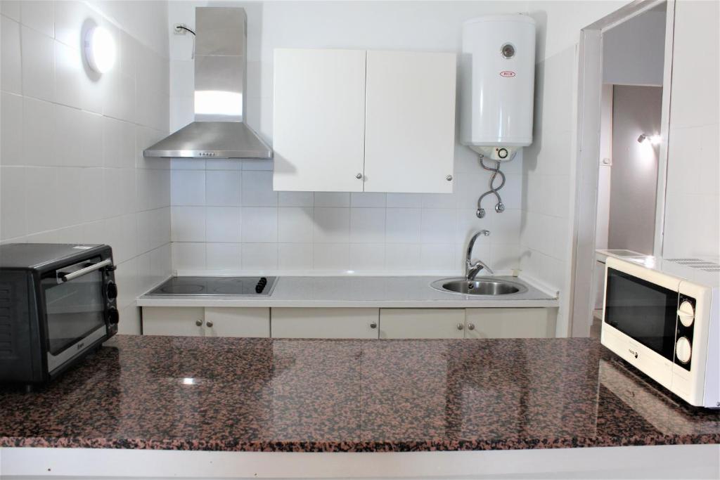 Kuchyňa alebo kuchynka v ubytovaní Apartamento con vistas, playa y WIFI