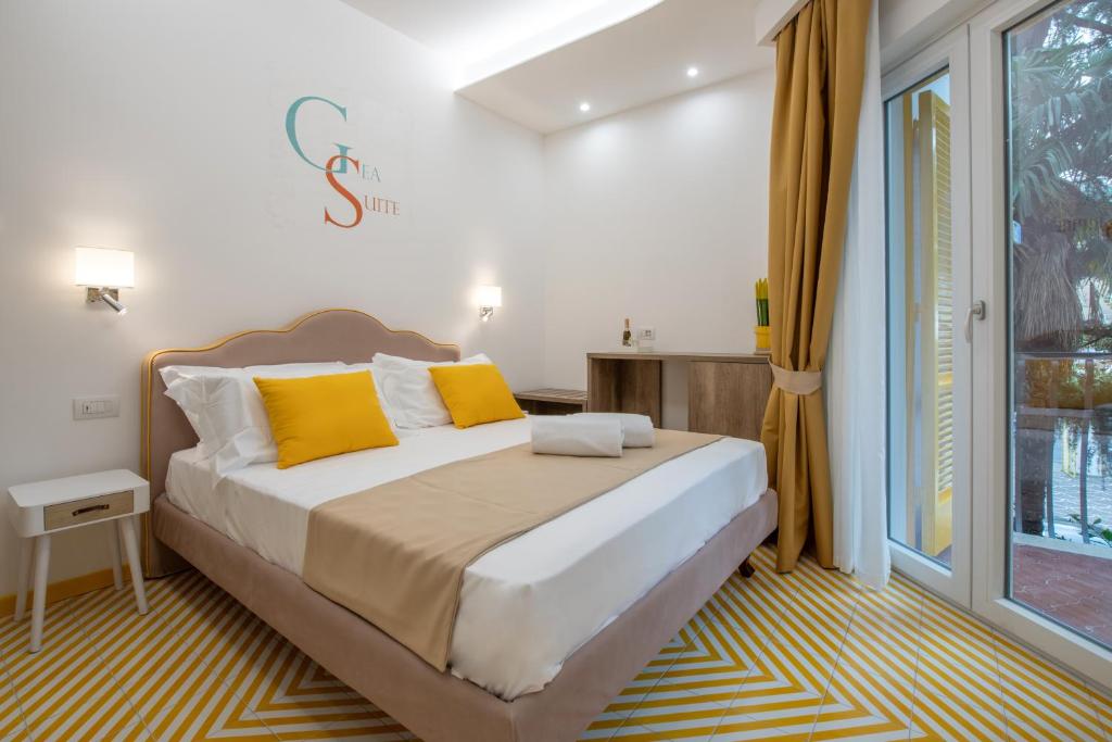 Postel nebo postele na pokoji v ubytování Gea Suite B&B