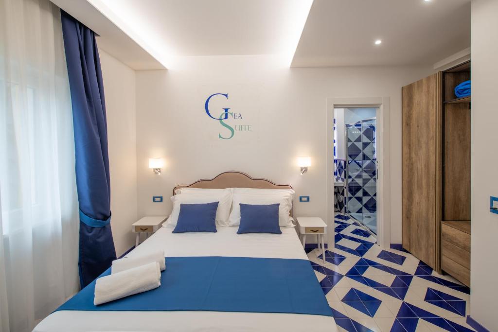 Postel nebo postele na pokoji v ubytování Gea Suite B&B