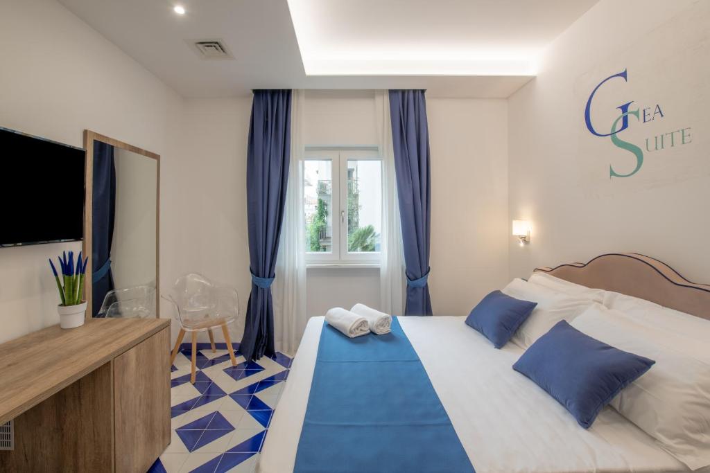 Postel nebo postele na pokoji v ubytování Gea Suite B&B