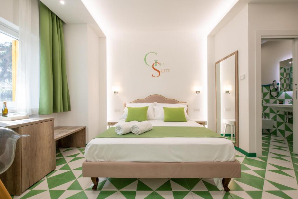 Postel nebo postele na pokoji v ubytování Gea Suite B&B