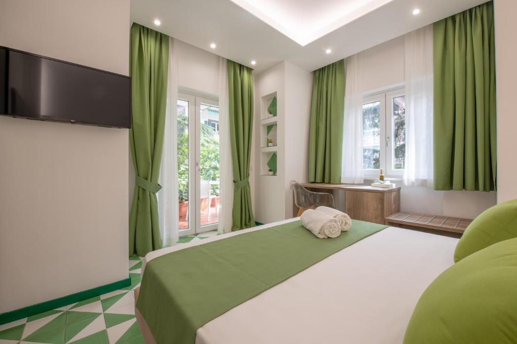 Postel nebo postele na pokoji v ubytování Gea Suite B&B