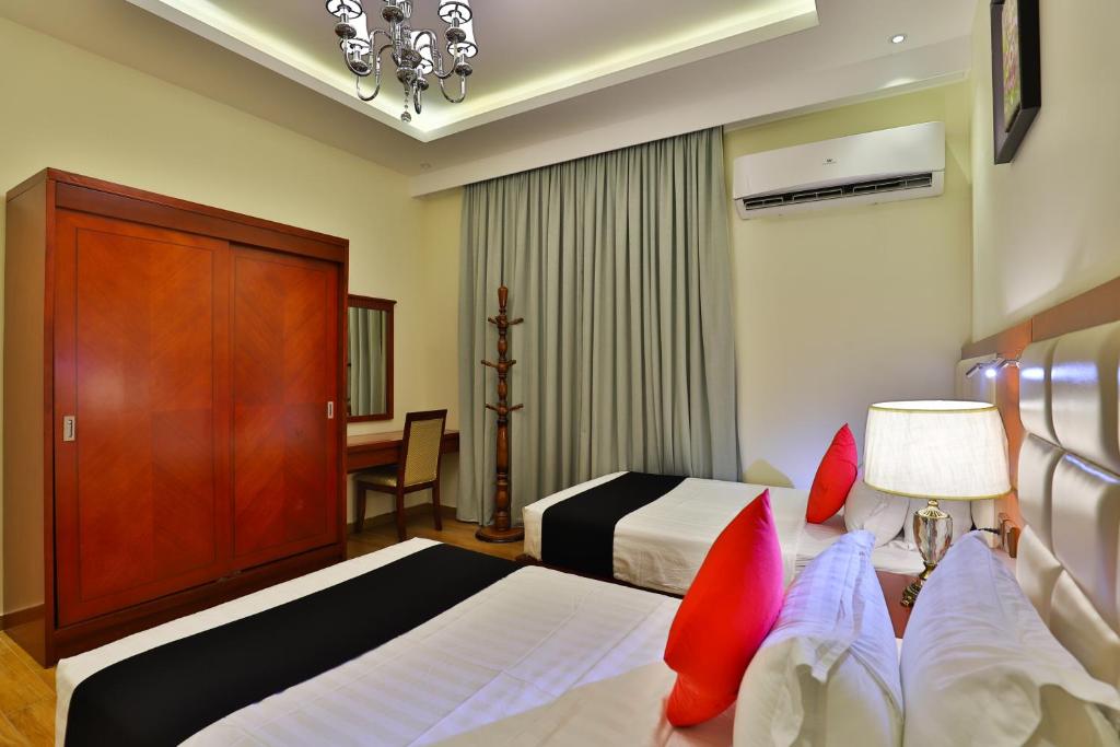 Postel nebo postele na pokoji v ubytování Dreams Houses furnished Suites