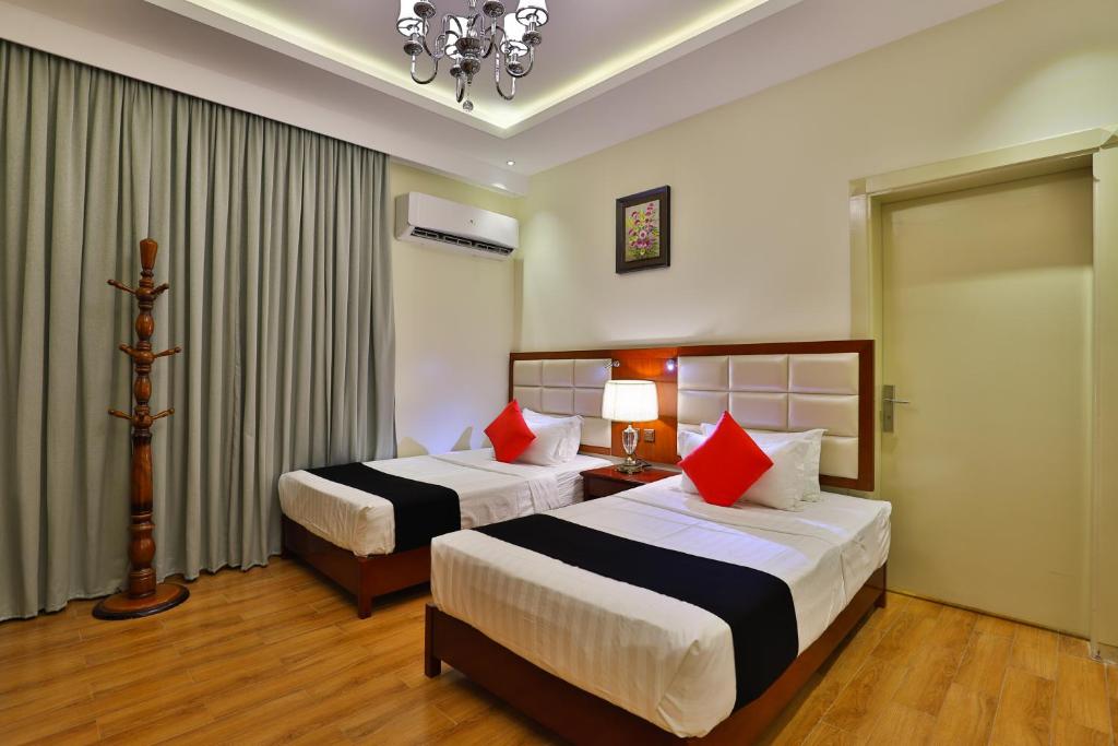 Postel nebo postele na pokoji v ubytování Dreams Houses furnished Suites