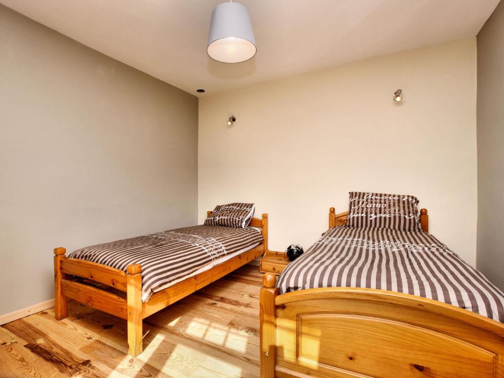 Postel nebo postele na pokoji v ubytování Holiday Home in Ardennes with Sauna