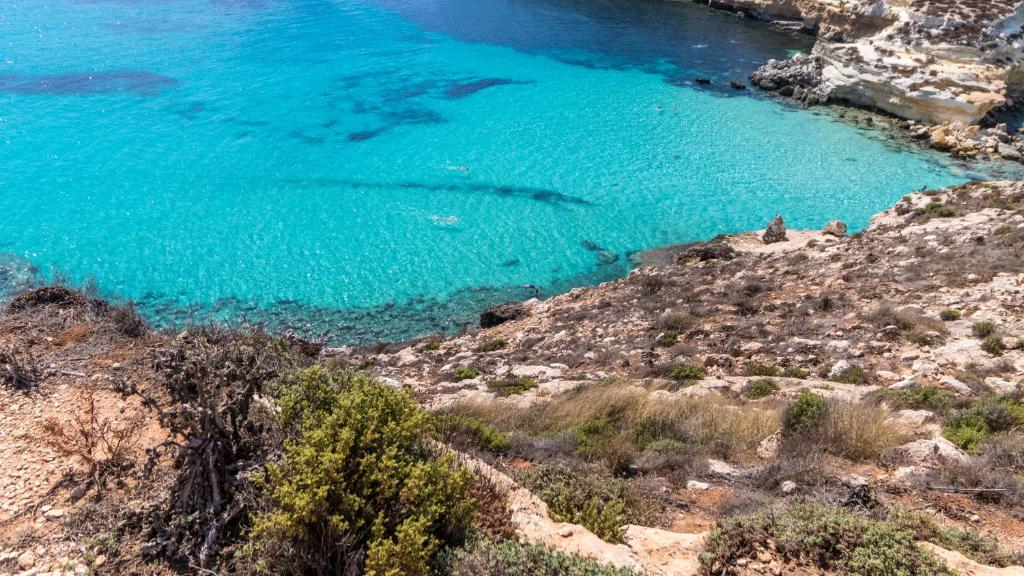 an aerial view of a beach with blue water at Italianway - Ottoventi Apartments in Lampedusa