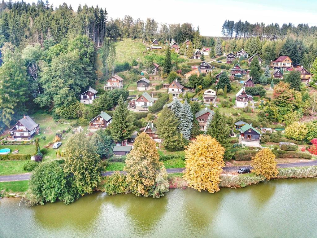 an aerial view of a small village on a lake at Chata Dolce in Trutnov