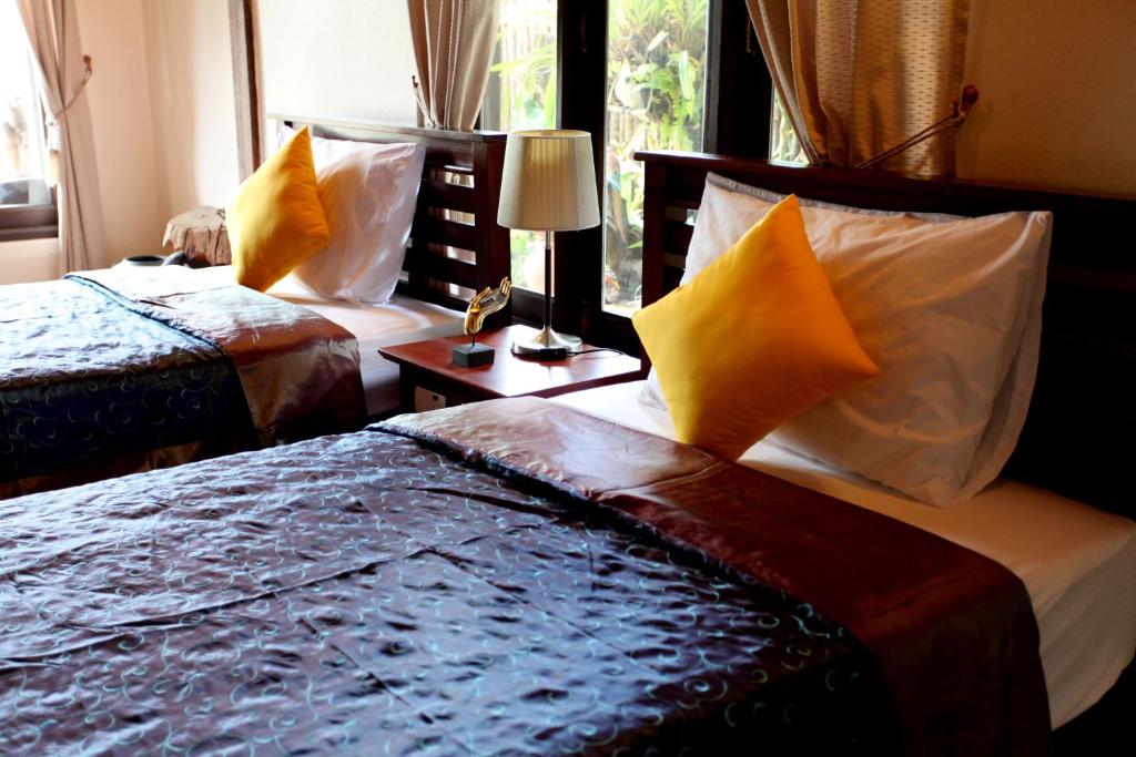 Postel nebo postele na pokoji v ubytování Ao Nang Home Stay - Adults Only