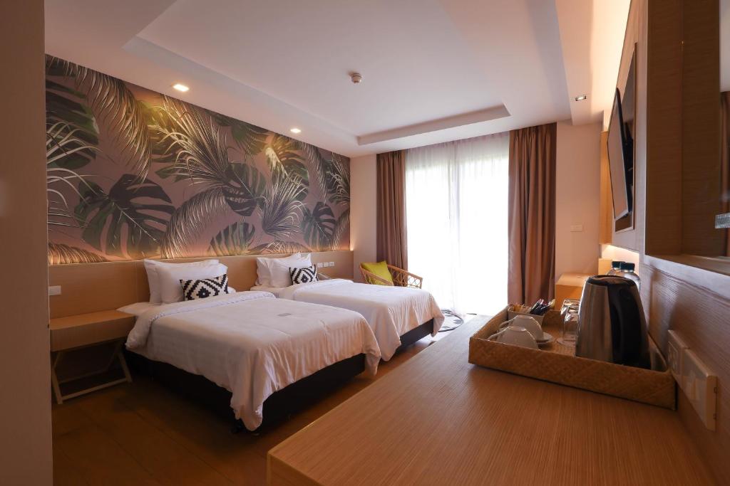 Postel nebo postele na pokoji v ubytování Panan Krabi Resort