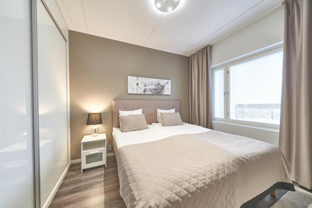 Кровать или кровати в номере Tahko Spa Hotel