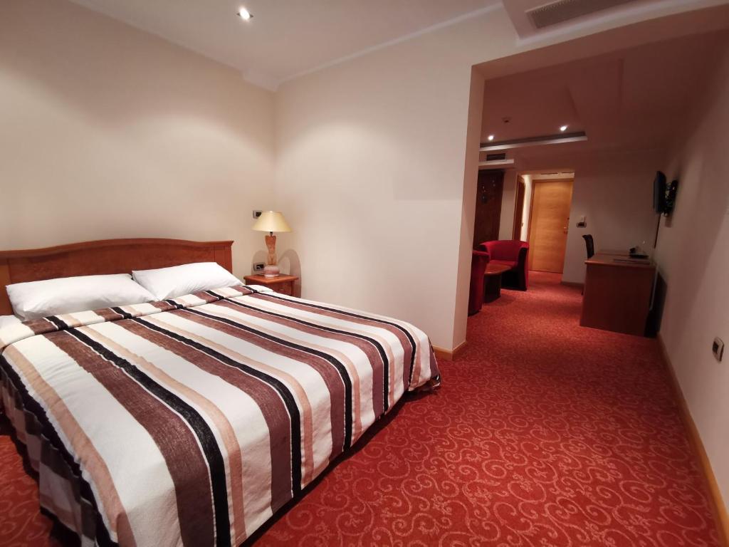 Postel nebo postele na pokoji v ubytování Mali Hotel BaMBiS