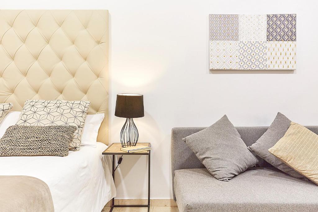 Postel nebo postele na pokoji v ubytování LEEWAYS LOFT XVI in GRAN VÍA