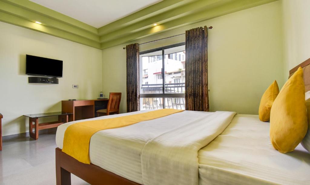 Postel nebo postele na pokoji v ubytování Hotel Garden Inn